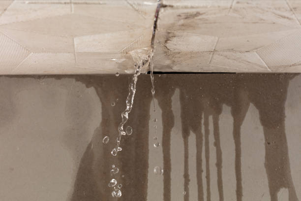 Professional Flood Damage Cleanup technician working in Glassport, PA